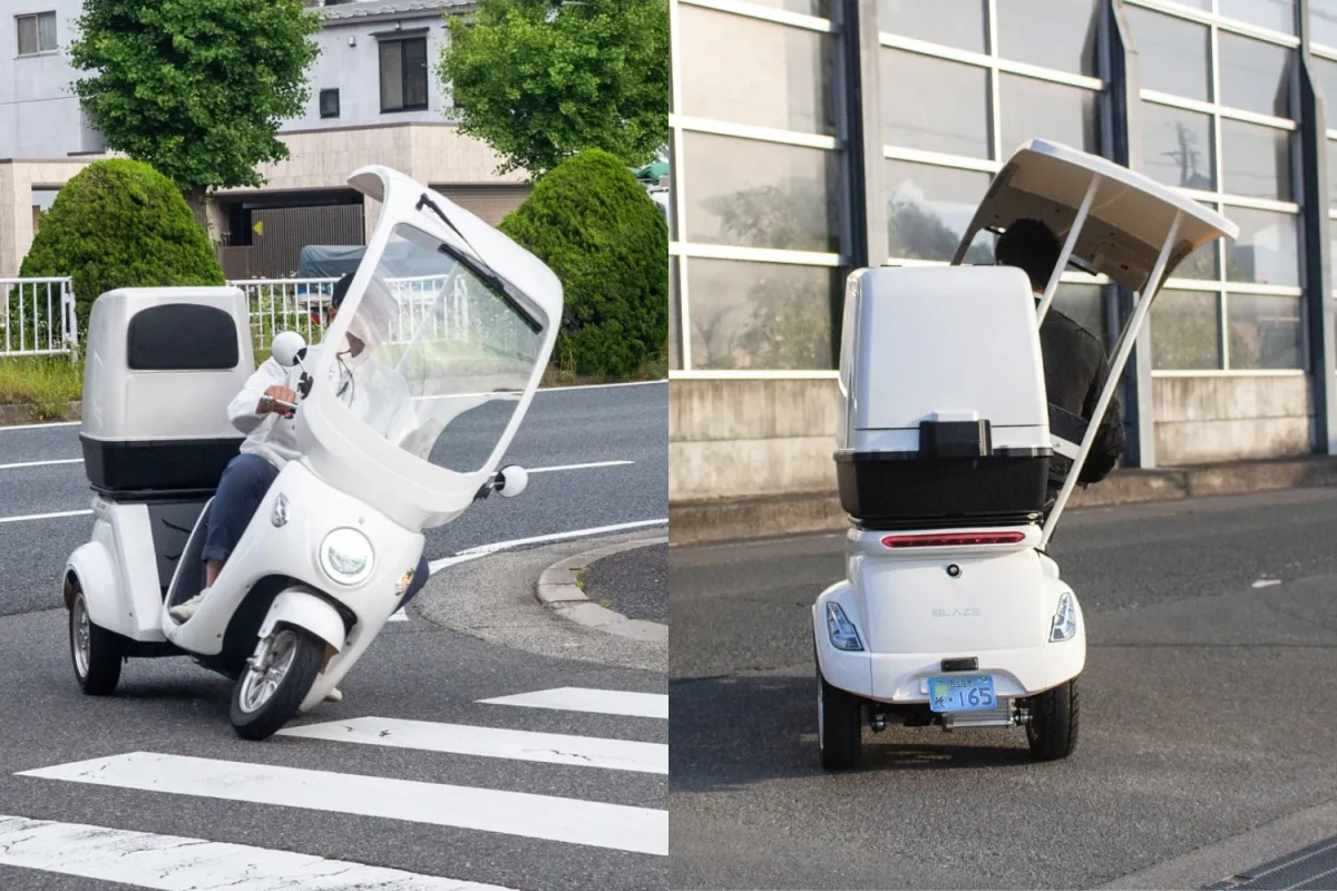 白い三輪の電動バイクに乗っている人
